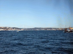 The Bosphorus Bridge and boats in the Bosphorus strait, viewed from the Bosphorus ferry