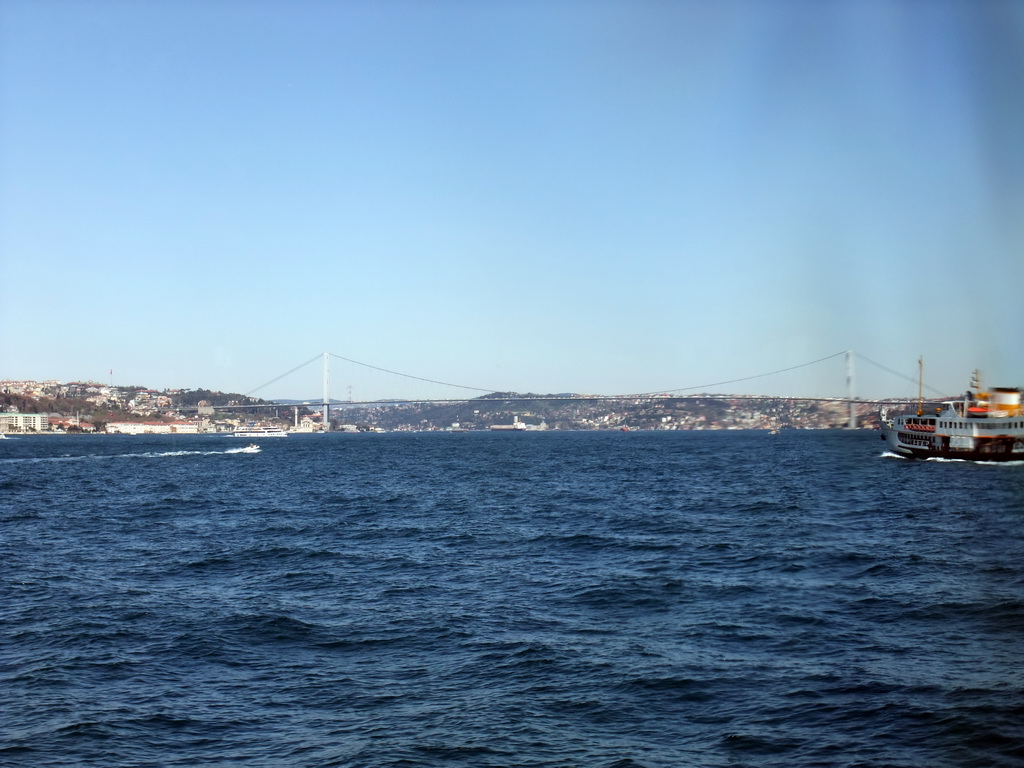 The Bosphorus Bridge and boats in the Bosphorus strait, viewed from the Bosphorus ferry