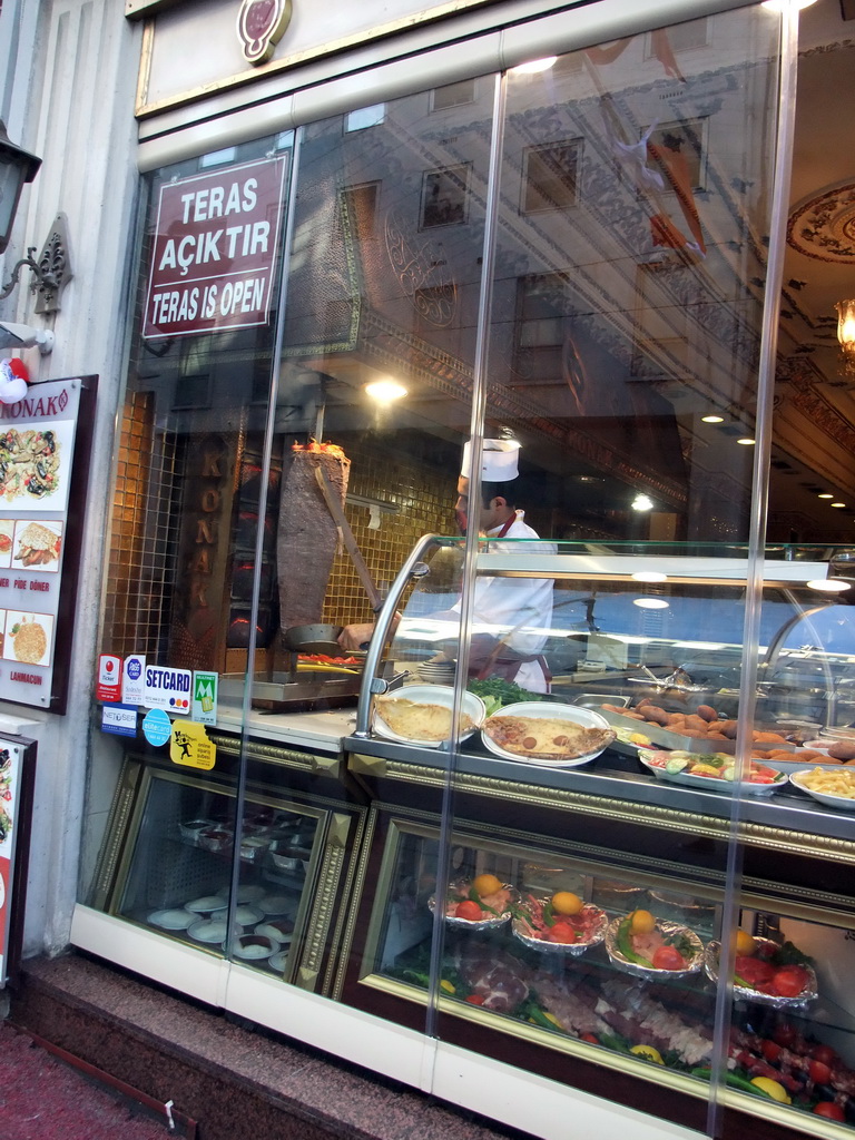 Cook cutting doner kebab in a restaurant at Istiklal Avenue