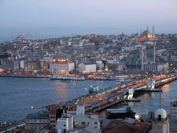 View on the Galata Bridge, the Golden Horn, the Blue Mosque, the New Mosque and the Nuruosmaniye Mosque, from the top of the Galata Tower, at sunset