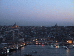 View on the Galata Bridge, the Golden Horn, the New Mosque, the Nuruosmaniye Mosque and the Bayezid II Mosque, from the top of the Galata Tower, at sunset