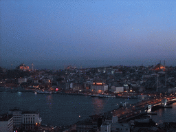 View on the Galata Bridge, the Golden Horn, the Hagia Sophia, the Blue Mosque, the New Mosque and the Nuruosmaniye Mosque, from the top of the Galata Tower, by night