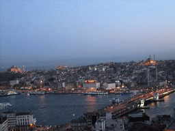 View on the Galata Bridge, the Golden Horn, the Hagia Sophia, the Blue Mosque, the New Mosque and the Nuruosmaniye Mosque, from the top of the Galata Tower, by night