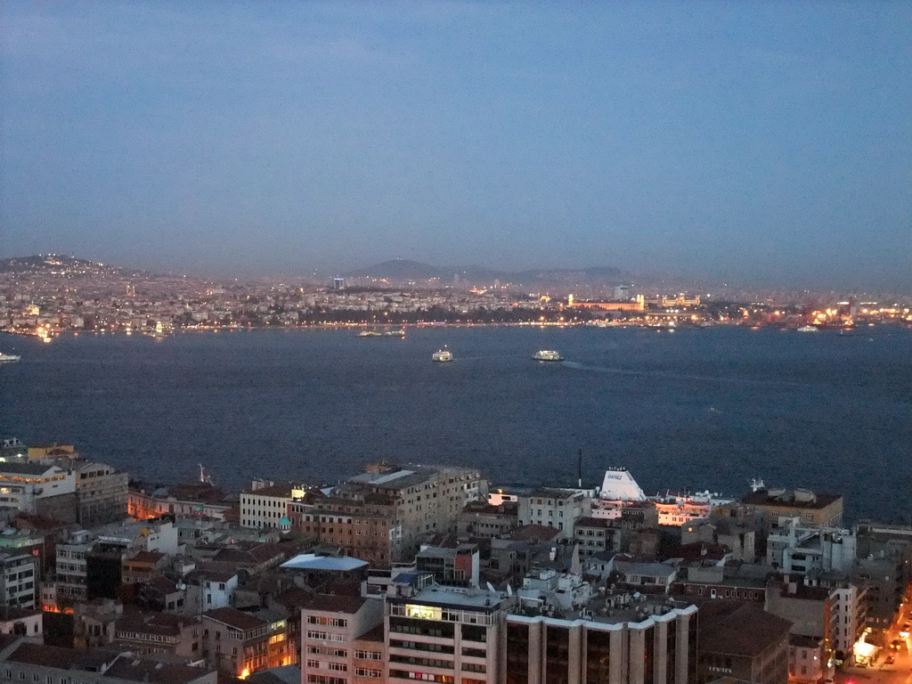 View on the Bosphorus straight and the Kadikoy district, from the top of the Galata Tower, by night