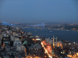 View on the Nusretiye Mosque, the Molla Celebi Mosque and the Bosphorus Bridge over the Bosphorus straight, from the top of the Galata Tower, by night