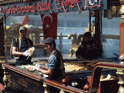 Cooks preparing fish at a fish boat restaurant in the Golden Horn bay