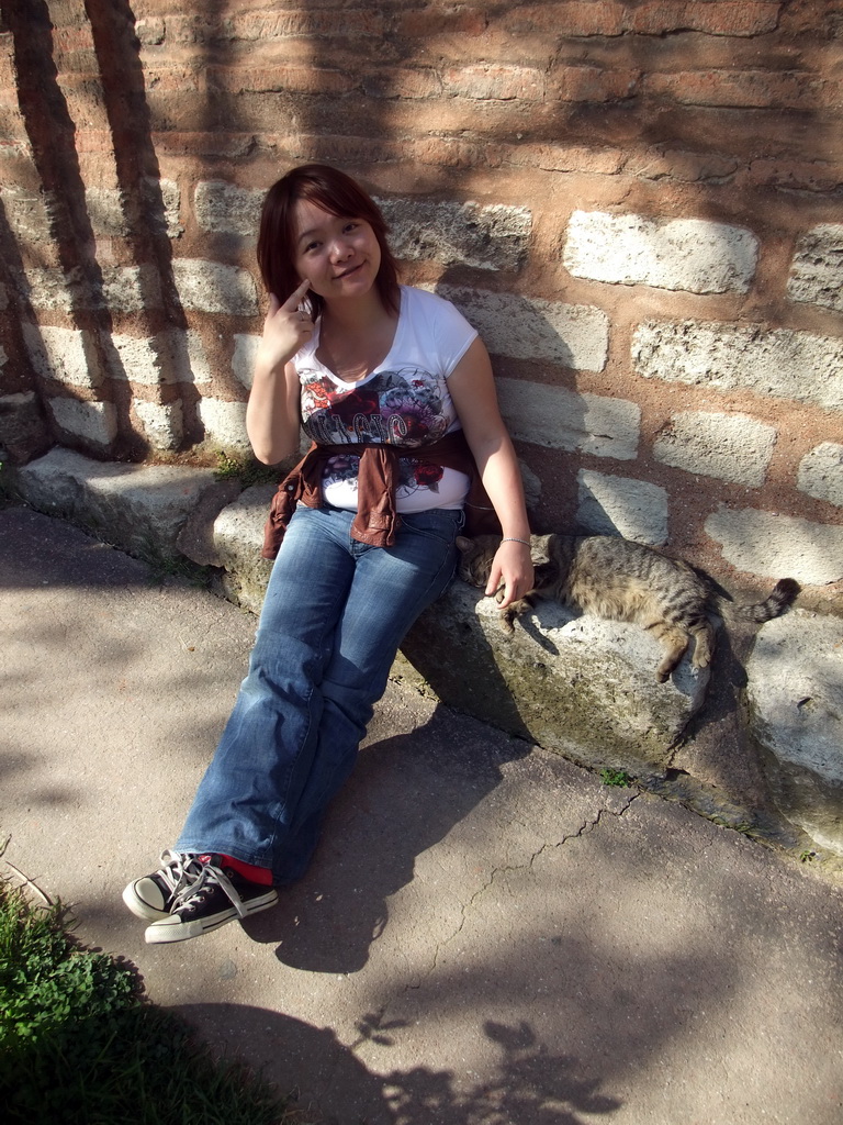 Miaomiao with cat at the side of the Church of St. Savior in Chora