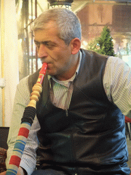 Man smoking waterpipe in the Corlulu Ali Pasa Medresesi medrese