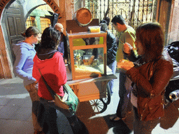 Miaomiao, Ana and Nardy buying a snack from a food stall in front of the Corlulu Ali Pasa Medresesi medrese