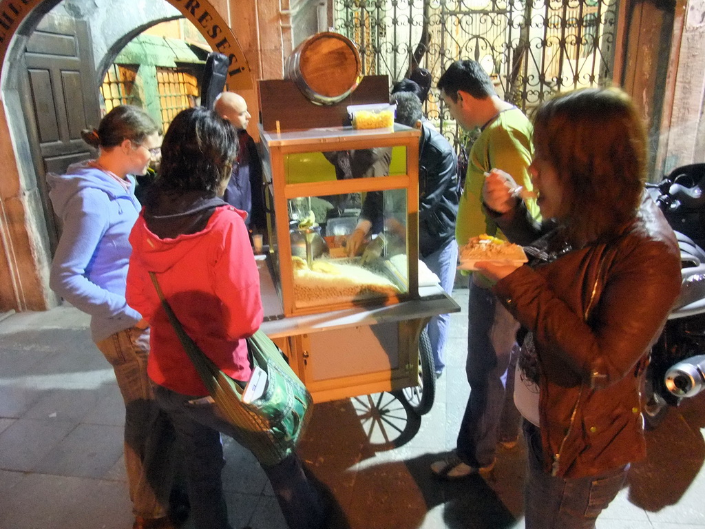 Miaomiao, Ana and Nardy buying a snack from a food stall in front of the Corlulu Ali Pasa Medresesi medrese