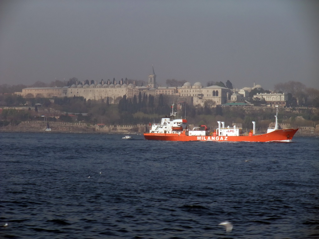 Topkapi Palace and a boat in the Bosphorus strait, viewed from the ferry