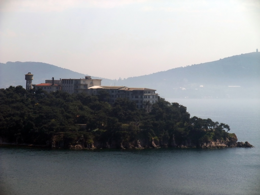 View on building at the southwestern side of Heybeliada island, with Büyükada island on the background