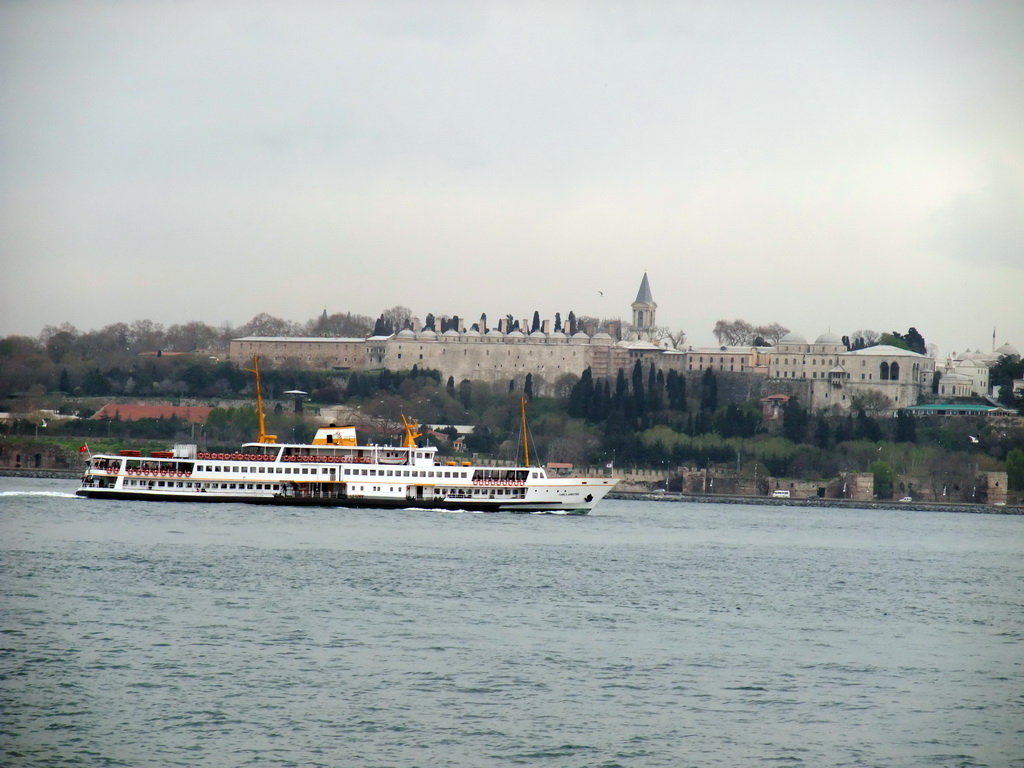 Topkapi Palace and a boat in the Bosphorus strait, viewed from the ferry