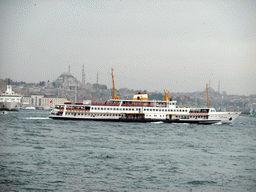 The Eminonu district with the New Mosque, the Süleymaniye Mosque and the Fatih Mosque, and boats in the Bosphorus strait, viewed from the ferry