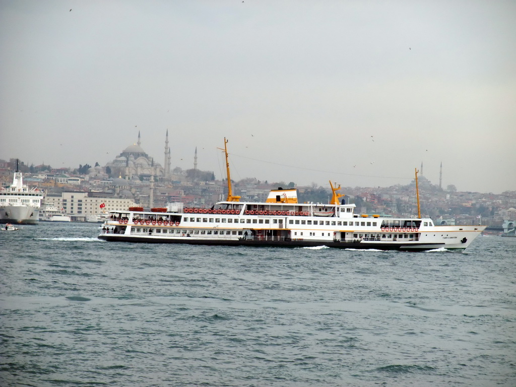 The Eminonu district with the New Mosque, the Süleymaniye Mosque and the Fatih Mosque, and boats in the Bosphorus strait, viewed from the ferry