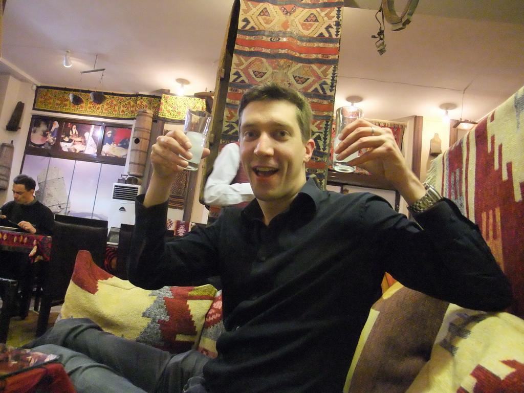 Tim with two glasses of raki in the Han Restaurant