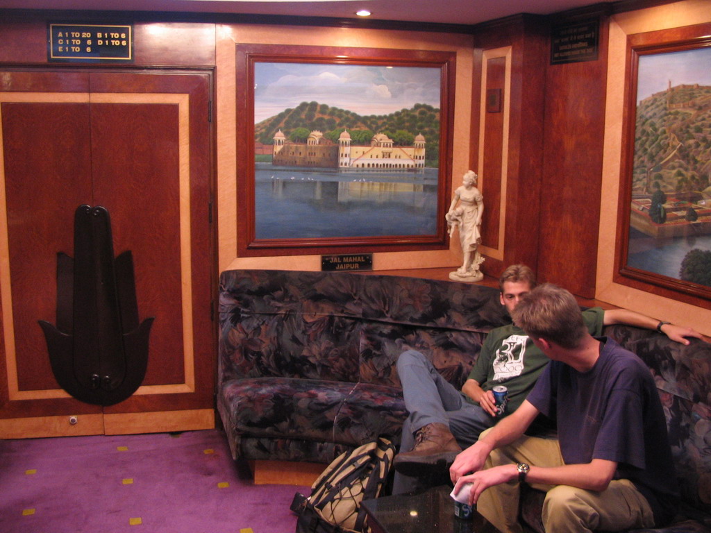 David and Rick in the Diamond Lounge of the Raj Mandir Cinema, with a painting of the Jal Mahal palace at the Man Sagar lake