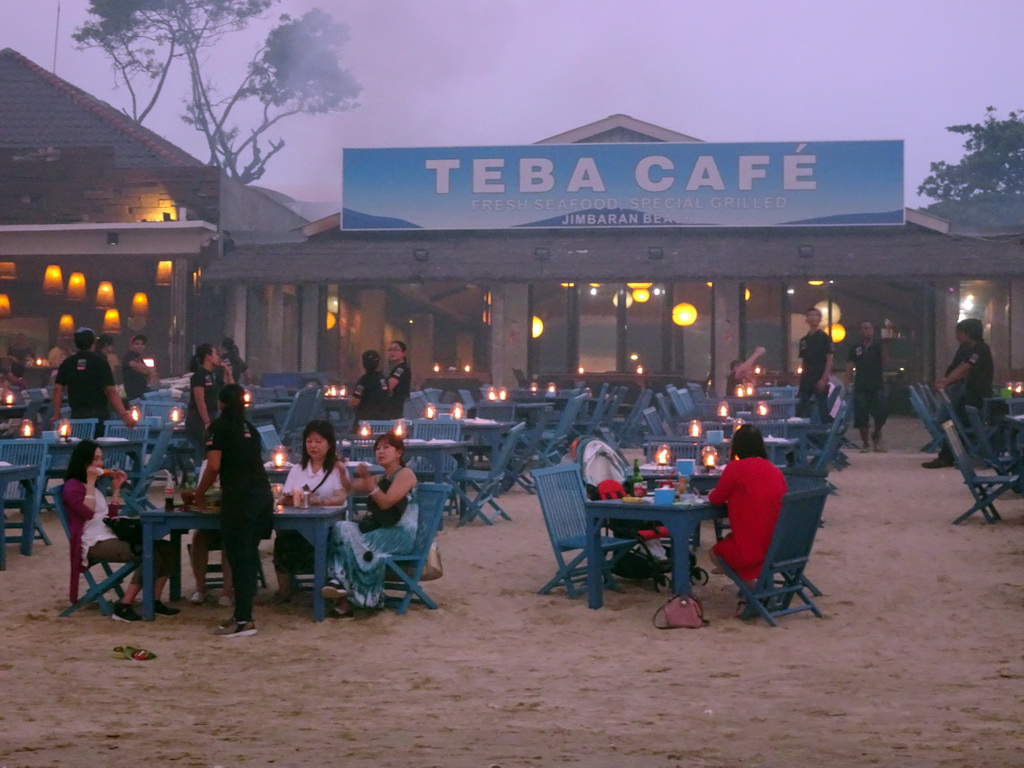Miaomiao and Max having dinner at the terrace of the Teba Café restaurant at Jimbaran Beach, at sunset