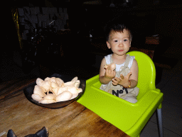 Max eating krupuks at the Fat Chow Temple Hill restaurant