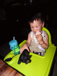 Max eating krupuks at the Fat Chow Temple Hill restaurant