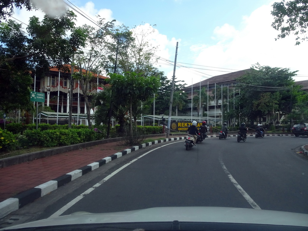 Front of the Rektorat building of Udayana University at the Jalan Raya Kampus Unud street, viewed from the taxi