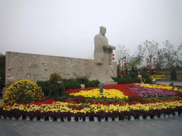 Statue and flowers at entrance of Qingming Shanghe Park