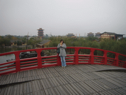 Miaomiao with candy on a bridge at Qingming Shanghe Park