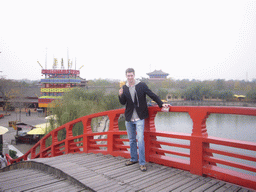 Tim with candy and map on a bridge at Qingming Shanghe Park
