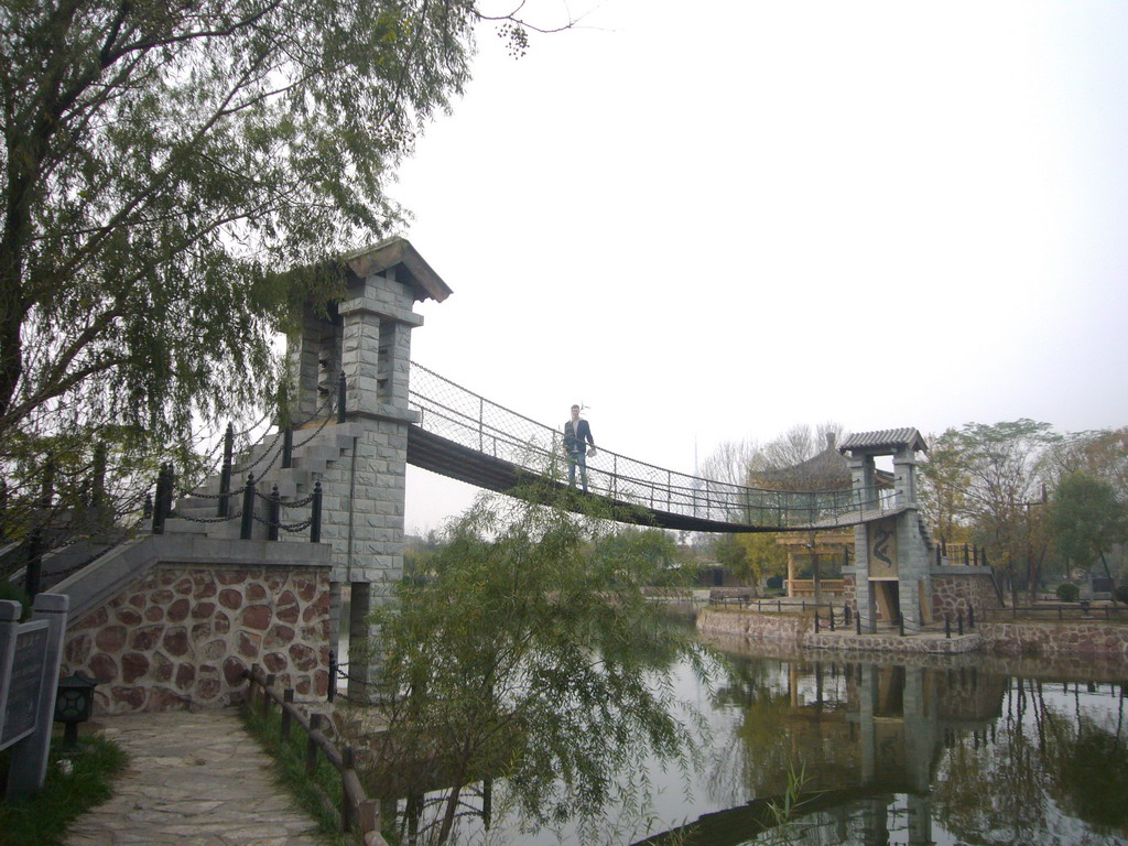 Tim on a suspension bridge at Qingming Shanghe Park