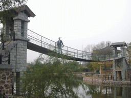 Tim on a suspension bridge at Qingming Shanghe Park
