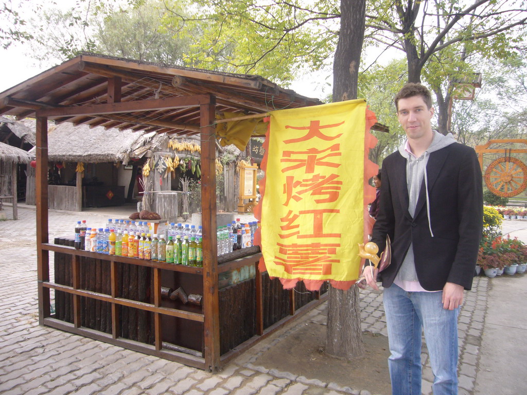Tim with candy at food store at Qingming Shanghe Park