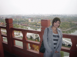 Miaomiao on top of the tall pavilion at Qingming Shanghe Park