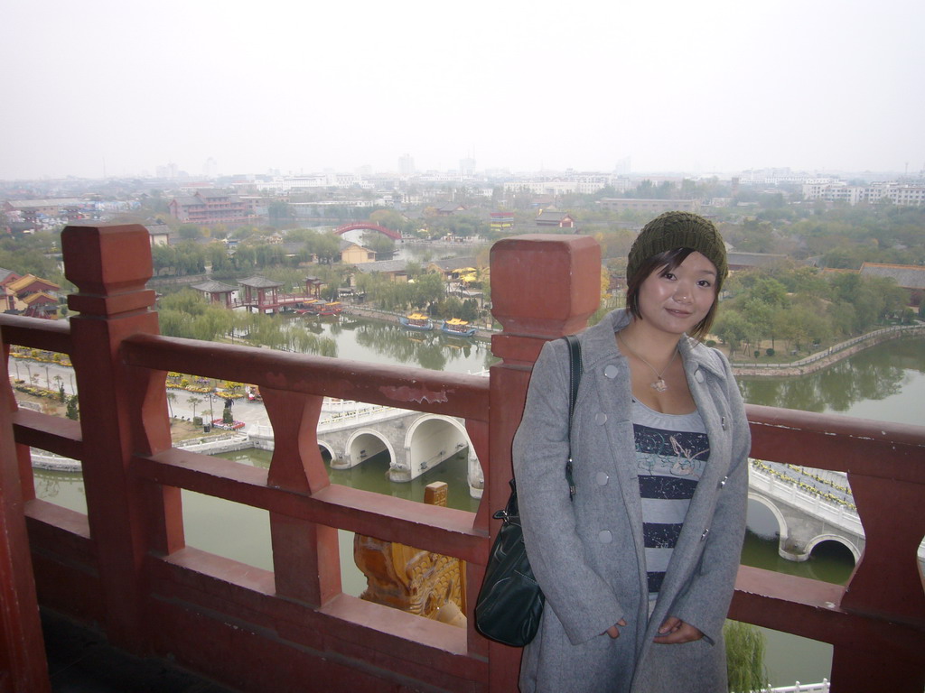 Miaomiao on top of the tall pavilion at Qingming Shanghe Park