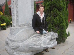 Tim with Dragon Turtle statue at Youguo Temple