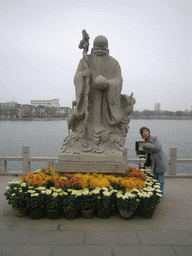 Miaomiao with statue of Budai at Youguo Temple