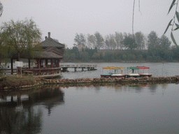 River with boats and pavilion at Youguo Temple