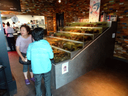 Miaomiao and her mother with lobsters and crabs at the Seafarm restaurant