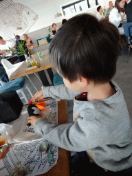 Max playing with toys at the Seafarm restaurant