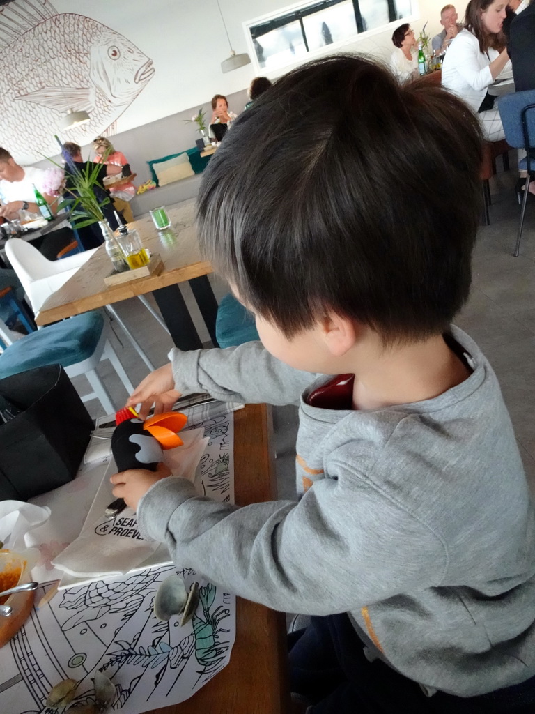 Max playing with toys at the Seafarm restaurant