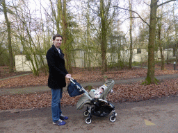 Tim with Max in a trolley on a road at the Center Parcs Kempervennen holiday park
