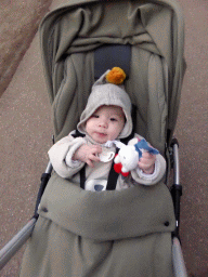 Max in a trolley on a road at the Center Parcs Kempervennen holiday park, at sunset