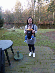 Miaomiao and Max in the garden at the back side of our holiday home at the Center Parcs Kempervennen holiday park, viewed from inside