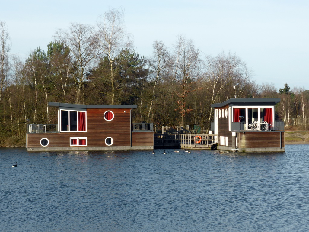 Holiday houseboats at the northeast side of the main lake at the Center Parcs Kempervennen holiday park
