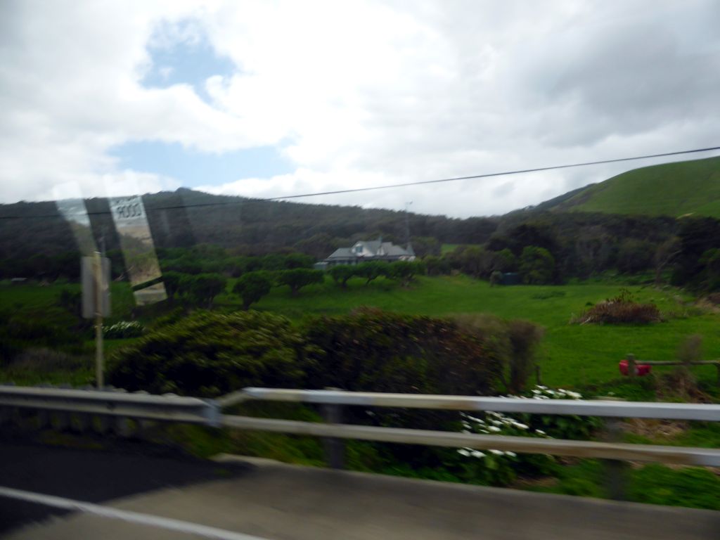 House and forested hills near Cape Patton, viewed from our tour bus on the Great Ocean Road