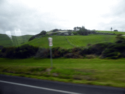 House and grasslands near Skenes Creek, viewed from our tour bus on the Great Ocean Road