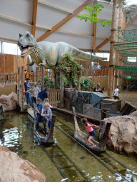 Statue of a Tyrannosaurus Rex and ferries at the DinoDome at the Limburg area at the GaiaZOO