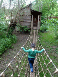 Max on a rope bridge at the JungleTour playground at the Limburg area at the GaiaZOO