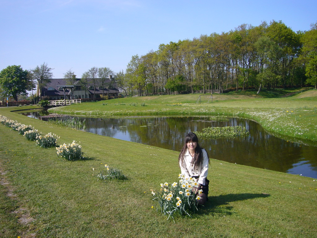 Chinese friend with white flowers along the road to the flower fields near Lisse