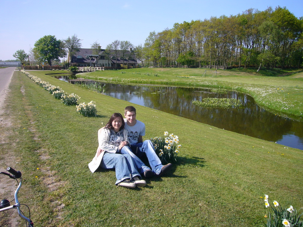 Tim and Miaomiao with white flowers along the road to the flower fields near Lisse