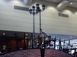 Bridge with street lanterns and bicycles in the Oranje Nassau pavilion at the Keukenhof park